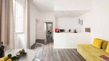 Deluxe Apartment, 2 Bedrooms | Living area | 32-inch LED TV with digital channels