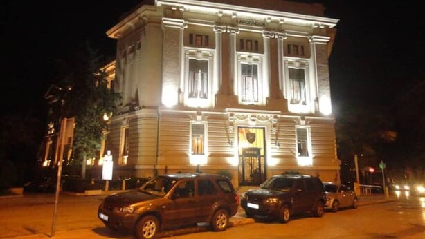 A large, historic building with classical architecture, featuring a prominent entrance and multiple windows. - Athenian Center Athens Kolonaki (Athina)