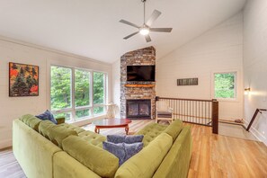 TV, fireplace, books - Pet-Friendly West Jefferson Home w/ River View! (West Jefferson)