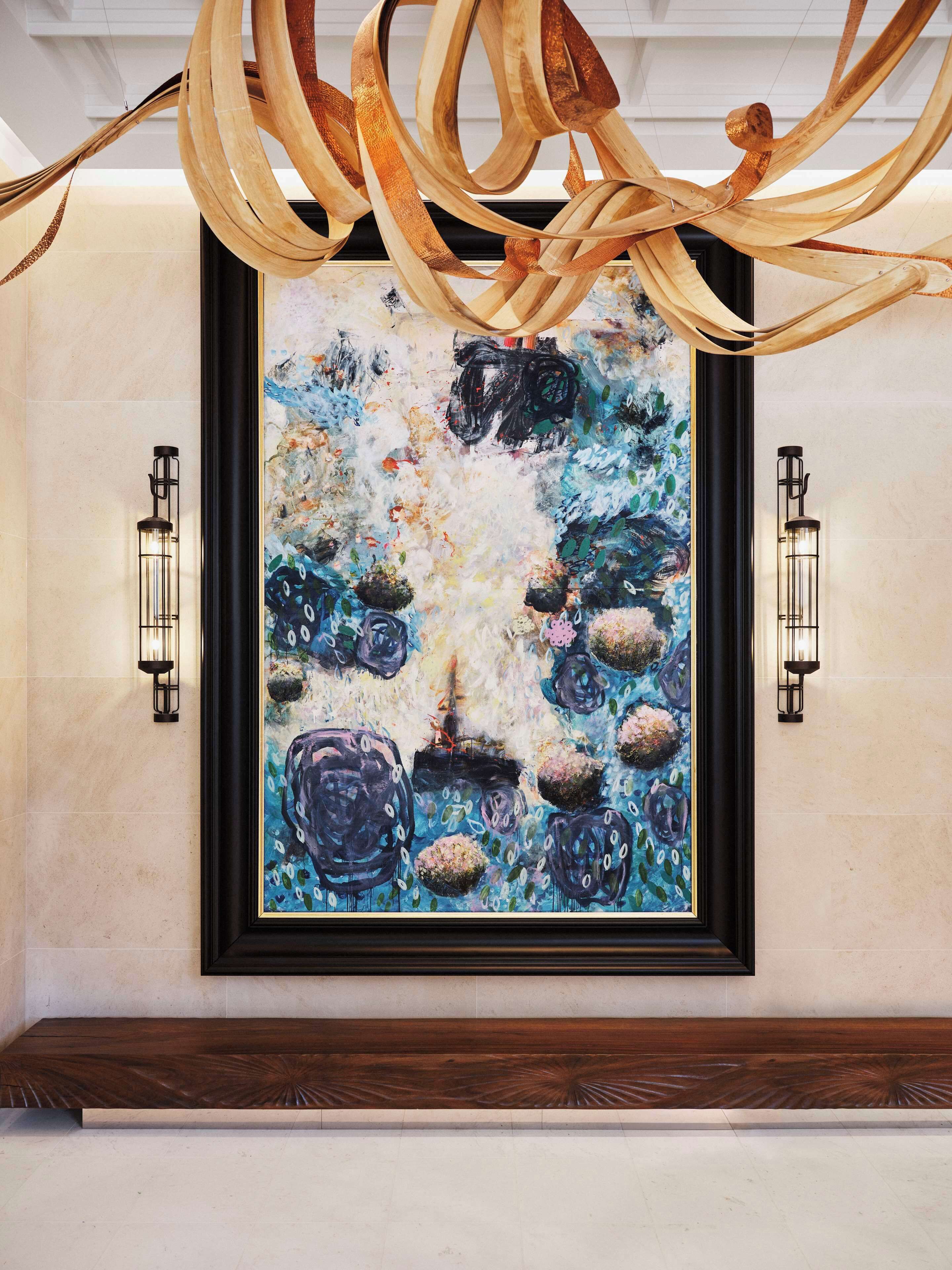 A framed abstract painting with a textured surface and a mix of blue and white tones.