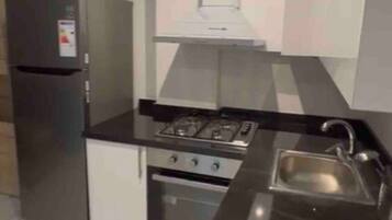 Fridge, coffee/tea maker, cookware/dishes/utensils