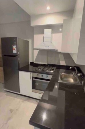 Fridge, coffee/tea maker, cookware/dishes/utensils