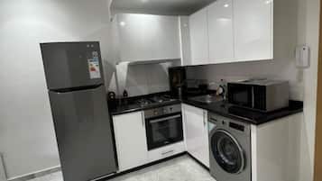 Fridge, coffee/tea maker, cookware/dishes/utensils