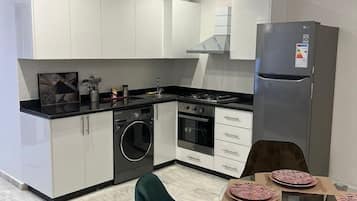 Fridge, stovetop, coffee/tea maker, cookware/dishes/utensils