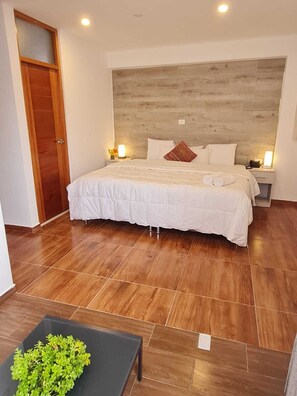 Family Triple Room | Down comforters, iron/ironing board, free WiFi, bed sheets - Hotel con garage en Cusco  (Cusco)