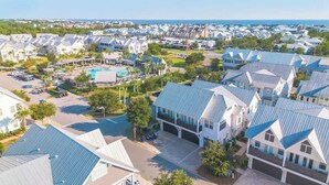 A residential area with houses, a swimming pool, and a clear view of the ocean. - 30A Seaside Escape by Stay on 30a (Inlet Beach)
