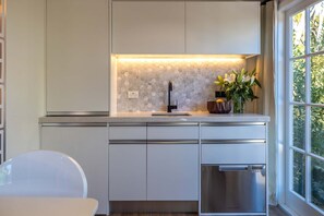 Fridge, microwave, dishwasher, coffee/tea maker