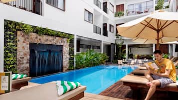 Outdoor pool, open 9:00 AM to 9:00 PM, free cabanas, pool umbrellas