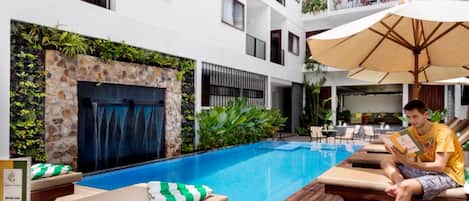 Outdoor pool, open 9:00 AM to 9:00 PM, free cabanas, pool umbrellas