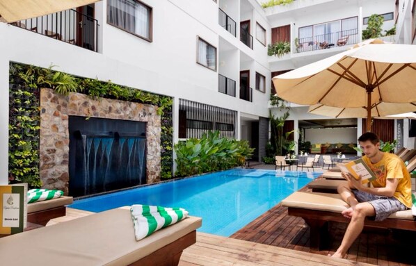 Outdoor pool, open 9:00 AM to 9:00 PM, free cabanas, pool umbrellas