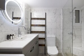 Shower, hair dryer, towels, soap