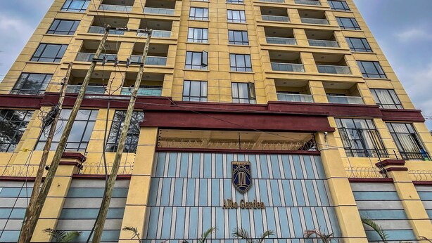 A high-rise building with multiple balconies and a gated entrance. - Alba Garden (Nairobi)