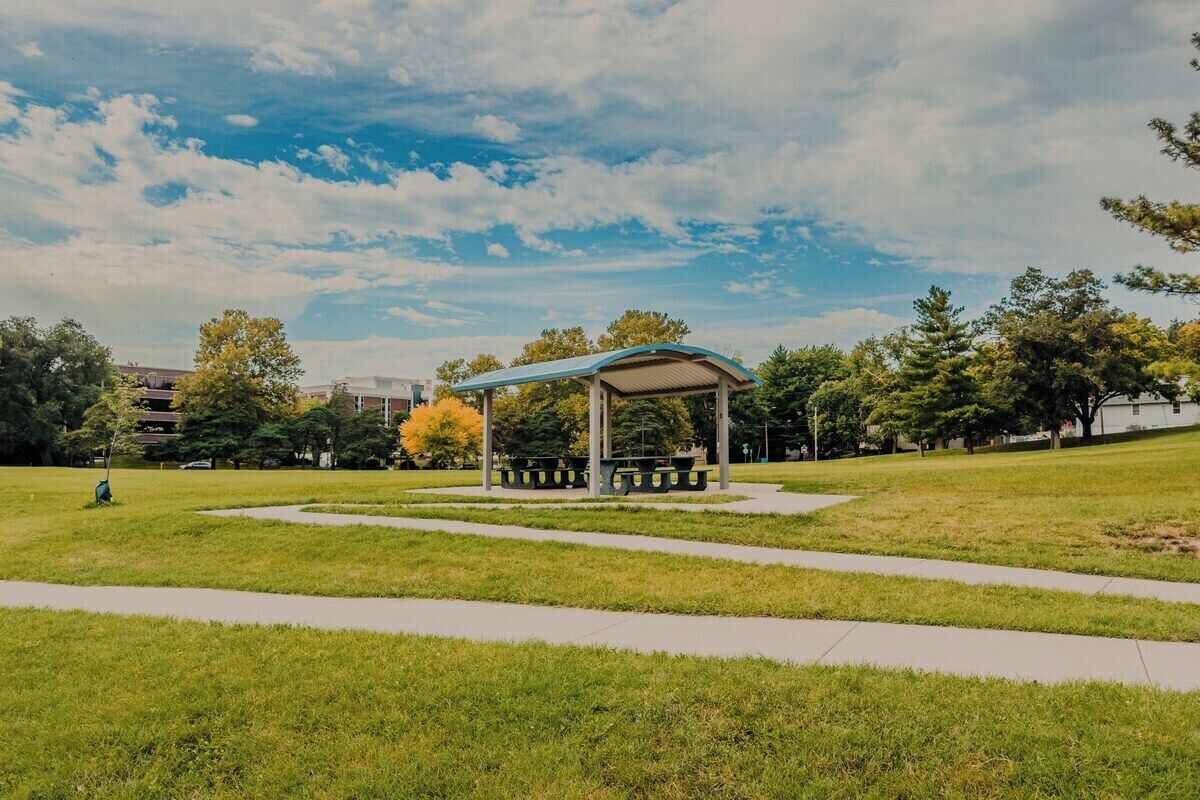 A park with a gazebo, pathways, and trees.