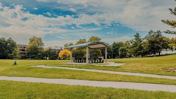 A park with a gazebo, pathways, and trees.