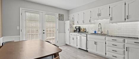 Open kitchen and dining area designed for shared meals and easy entertaining.