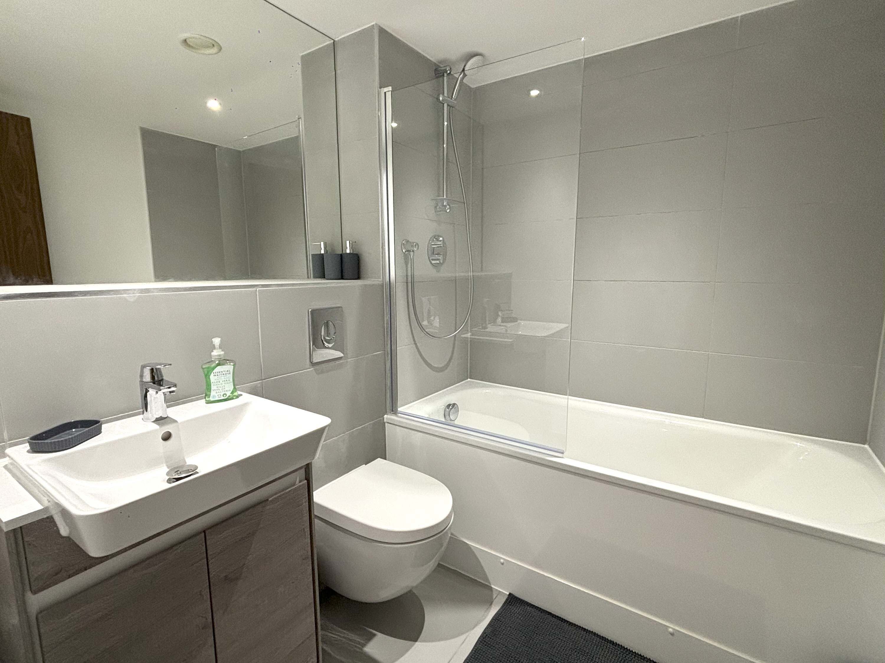 Shower, hair dryer, towels, shampoo