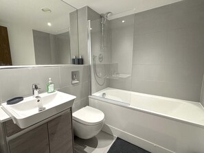 Shower, hair dryer, towels, shampoo