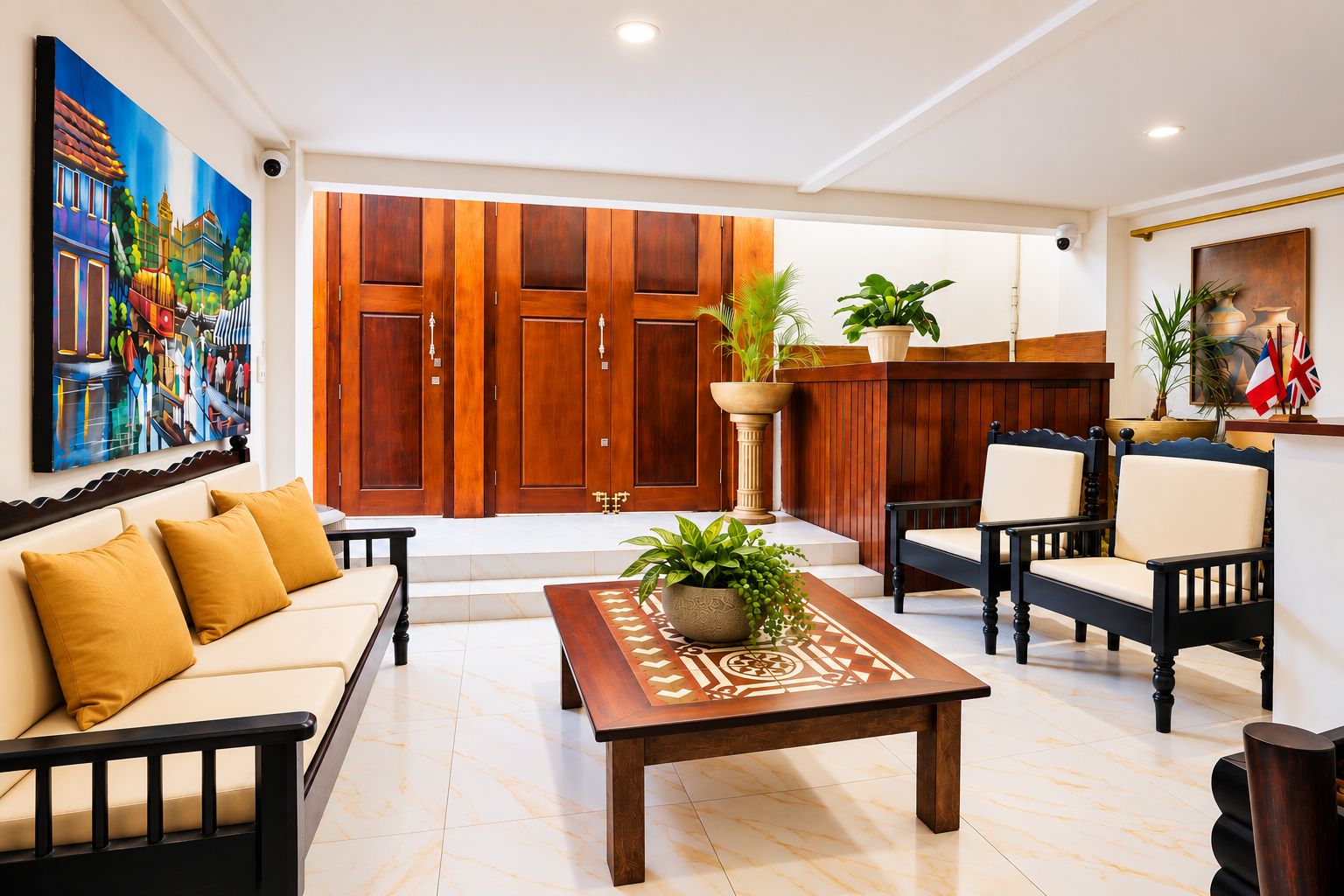 A spacious living area with a sofa, chairs, a coffee table, and a wooden wardrobe.