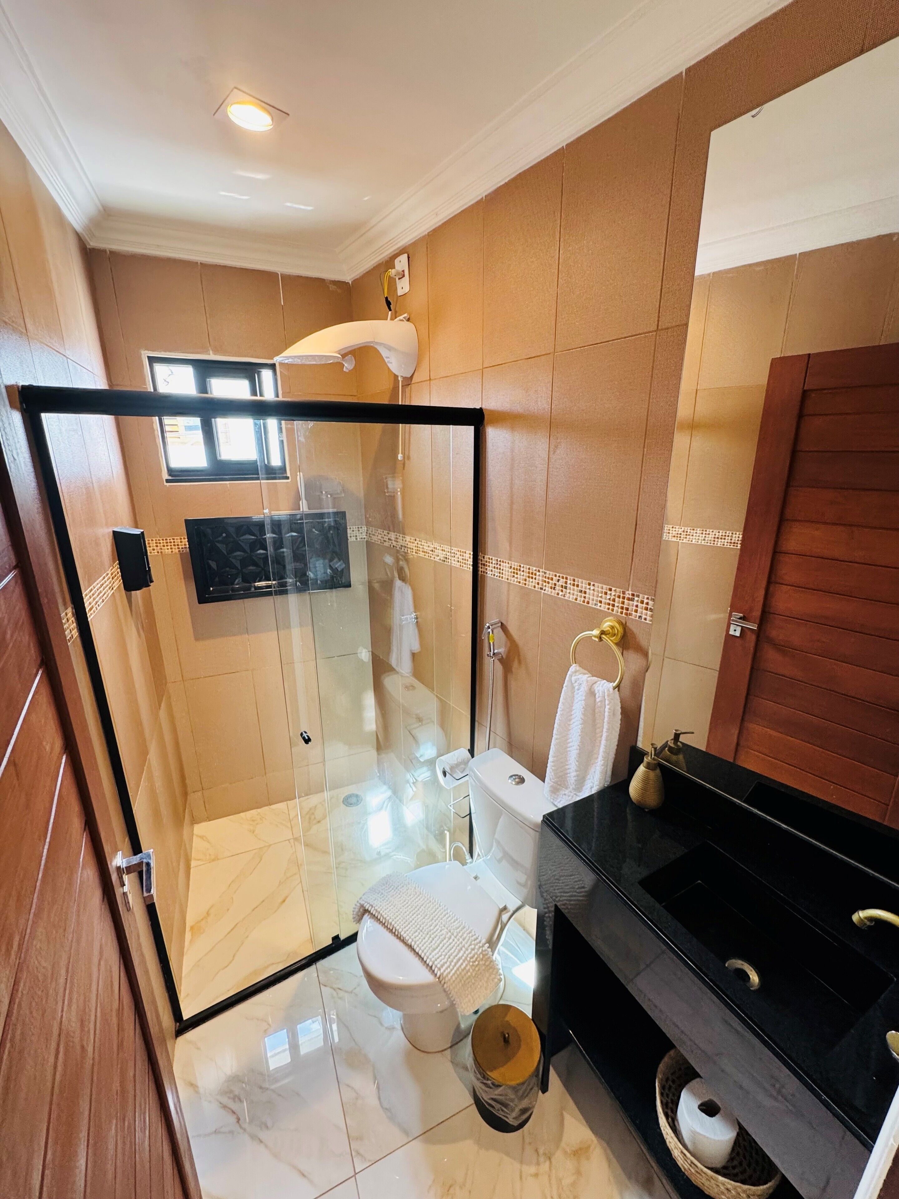 Deluxe Triple Room, City View | Bathroom | Shower, rainfall showerhead, hair dryer, towels