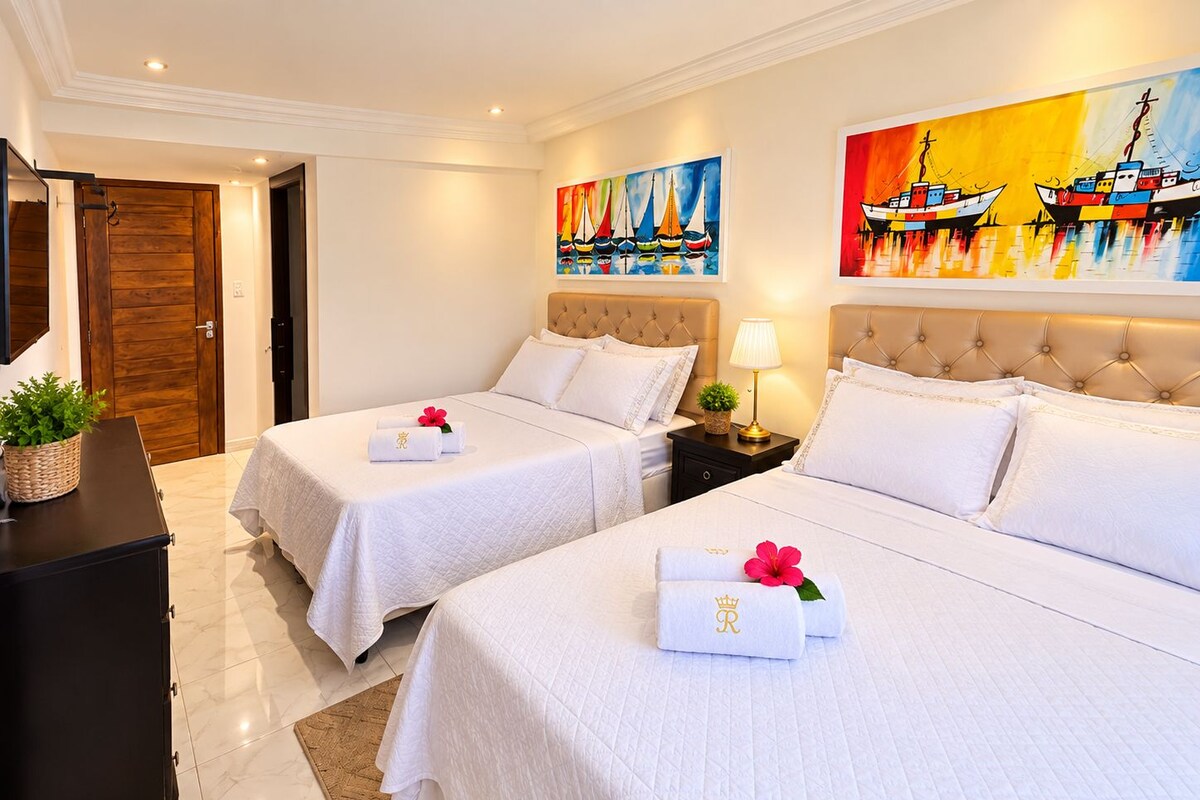 Deluxe Quadruple Room, Courtyard View | Premium bedding, minibar, in-room safe, free WiFi
