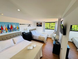 Panoramic Quadruple Room, Ocean View | Premium bedding, minibar, in-room safe, individually decorated