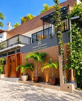 A residential building with a sign reading 'Residence Pipa Beach.'