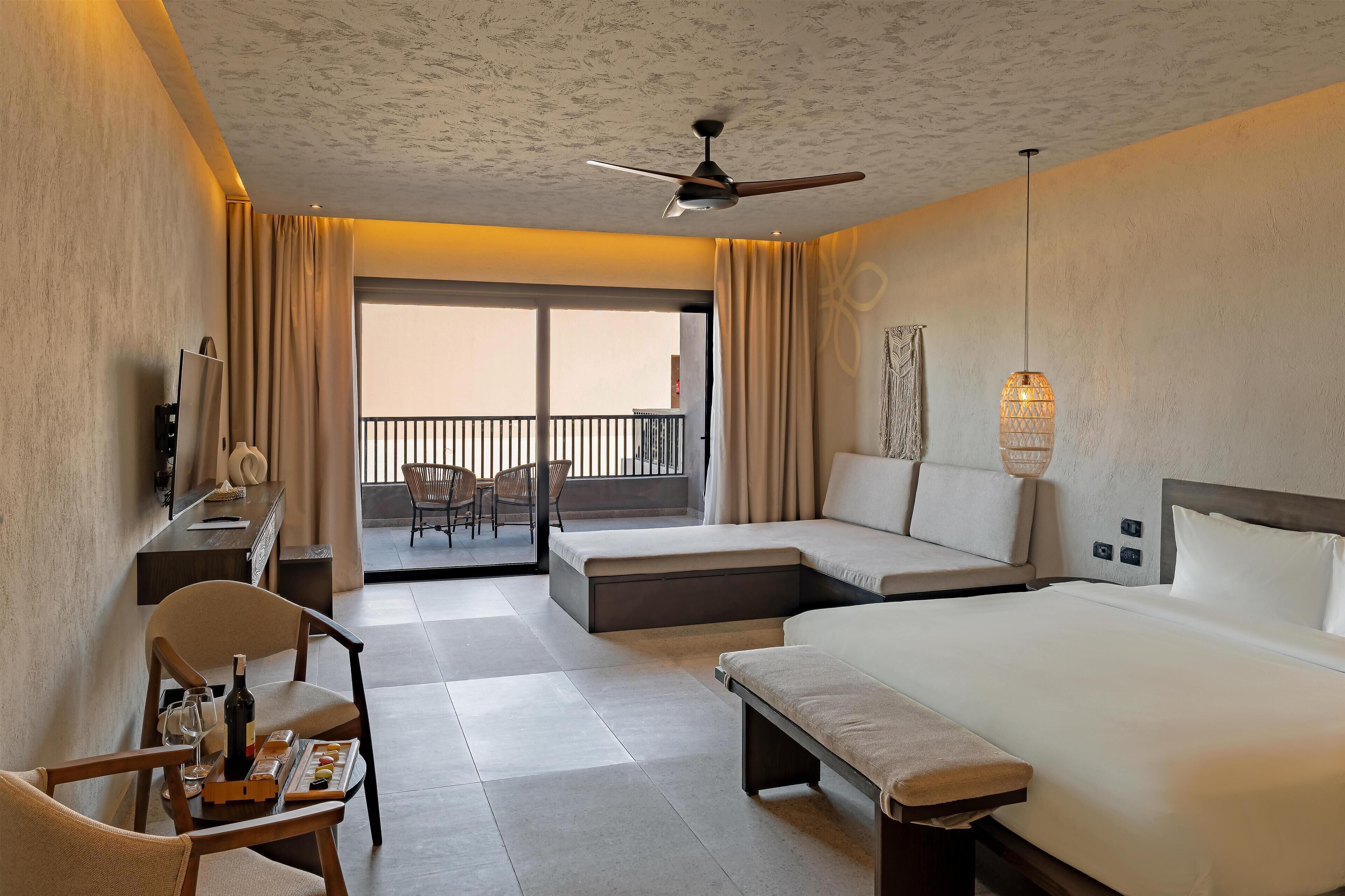 Junior Suite, 1 Bedroom, Sea View | Minibar, in-room safe, blackout drapes, soundproofing