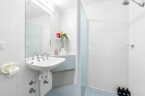 Shower, hair dryer, shampoo, toilet paper - Urban Oasis Chic CBD Suite with WiFi - Walkable (Adelaide)