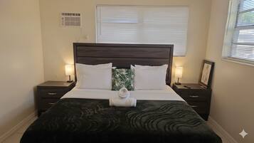 1 bedroom, desk, iron/ironing board, travel crib
