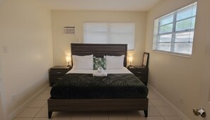 1 bedroom, desk, iron/ironing board, travel crib