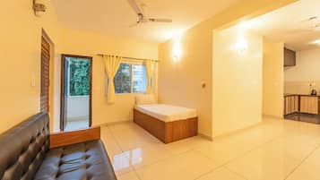 Standard Apartment | Living area | 42-inch flat-screen TV with cable channels