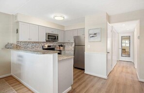 Coffee/tea maker, fridge, microwave, oven