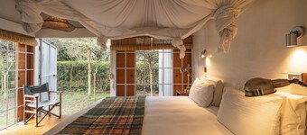 A unique, eco-friendly hideaway with walls that open to the savannah, allowing safari wildlife viewing from the comfort of the living room.