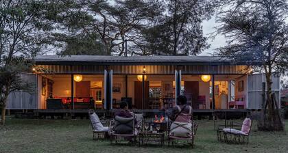 A unique, eco-friendly hideaway with walls that open to the savannah, allowing safari wildlife viewing from the comfort of the living room.