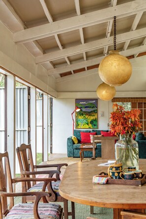 Dining - A unique, eco-friendly hideaway with walls that open to the savannah, allowing safari wildlife viewing from the comfort of the living room. (Naivasha)