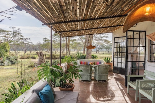 Spacious 5-bedroom safari lodge with lake views and wildlife at your doorstep.