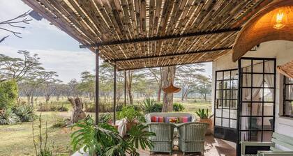 Spacious 5-bedroom safari lodge with lake views and wildlife at your doorstep.