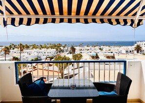 Enjoy a refreshing drink on this outdoor space with a view of the coastal town.