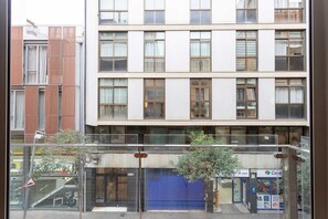 A multi-story building with large windows and a glass entrance.