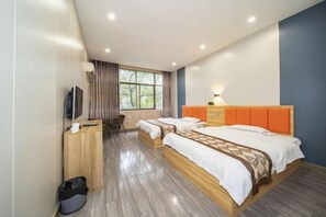 A modern hotel room with two beds, a desk, a television, and a window with curtains. - Yanyangtian Business Hotel (Yongzhou)