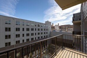 A multi-story building with a balcony.