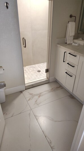 Shower, jetted tub, hair dryer, towels