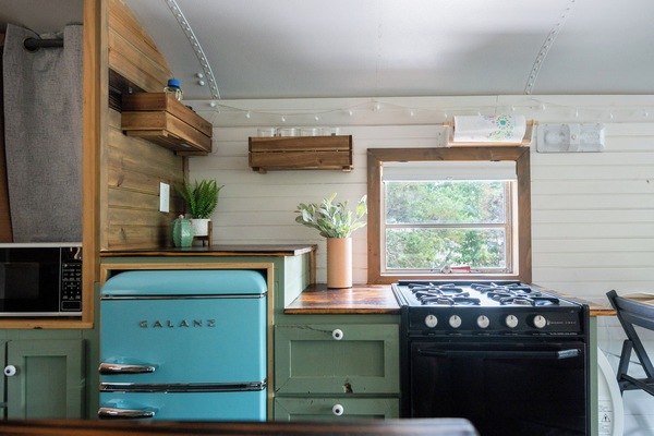 Fridge, microwave, coffee/tea maker, cookware/dishes/utensils