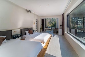 A modern hotel room with two beds, a large window, and a balcony. - Heshi Mogan Hotel (Deqing)