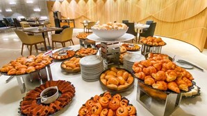 A buffet setup with various pastries and desserts. - Mais que um Hotel, uma Obra de Arte (São Conrado Rio de Janeiro)