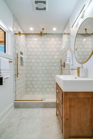 Shower, hair dryer, towels, soap