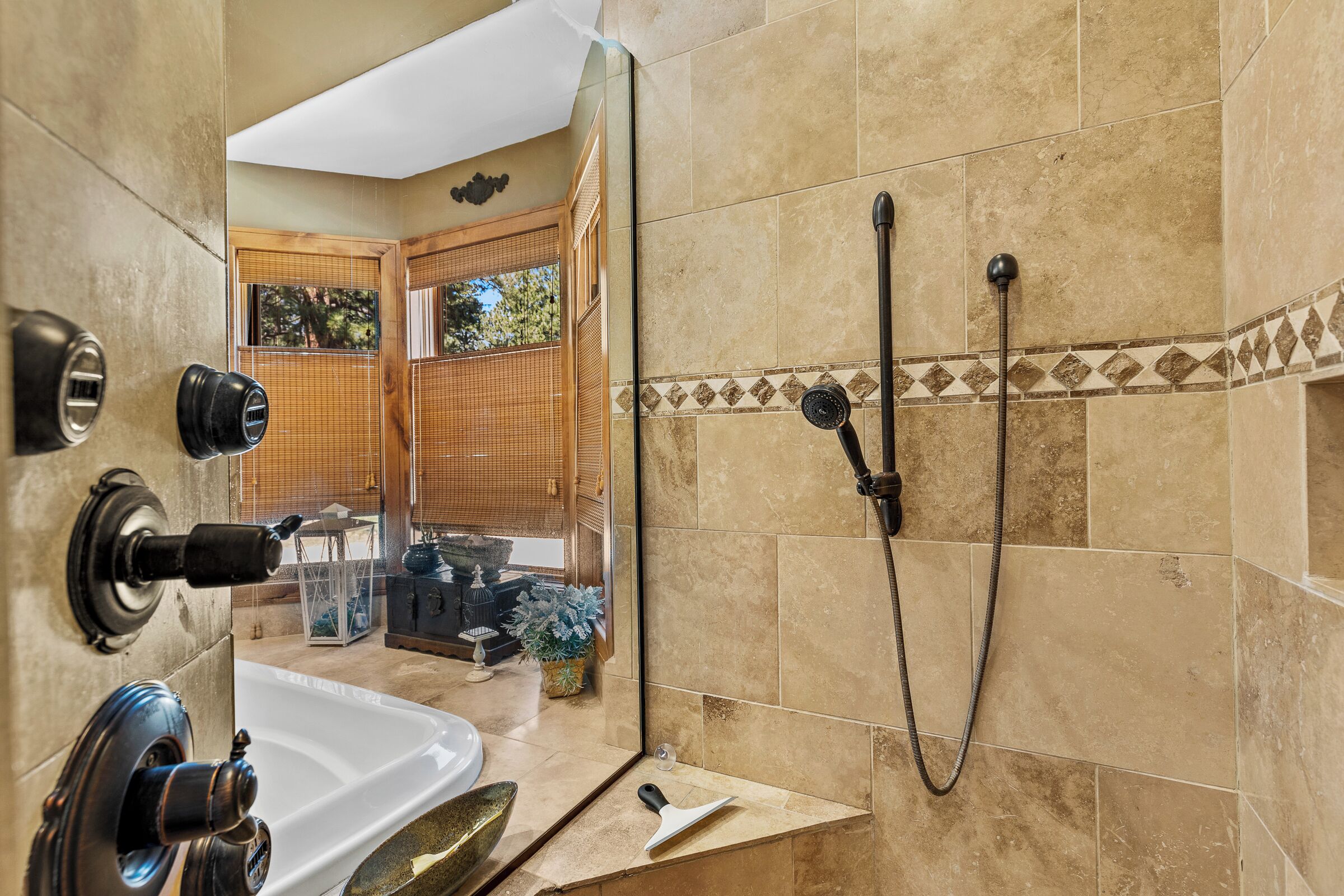 A bathroom with a bathtub, a shower, and a toilet.