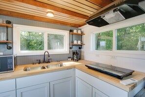 Fridge, microwave, coffee/tea maker, cookware/dishes/utensils