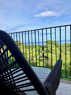 A balcony with a view of the sea and greenery. - Ocean View 2Br/2Bth Condo In Tamarindo (Tamarindo)