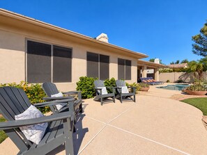 A house with a covered patio area, outdoor seating, and a swimming pool. - Lynx Chandler/ocotillo (Chandler)